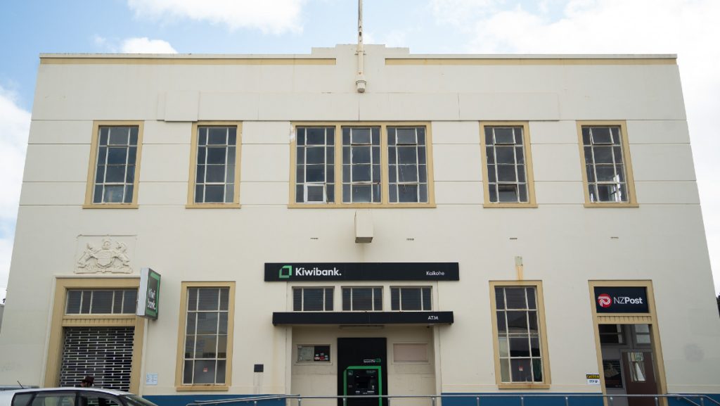 Front façade of The Exchange building in Kaikohe, a two-storey heritage structure with tall windows
