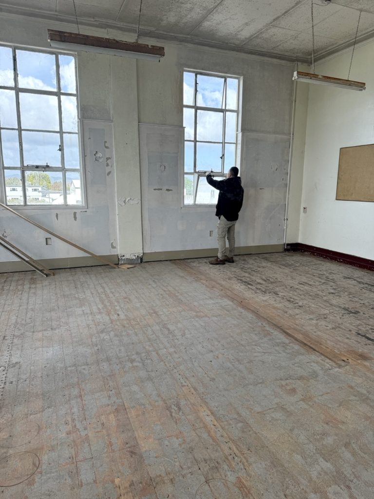Large open interior space at The Exchange with tall windows and natural light