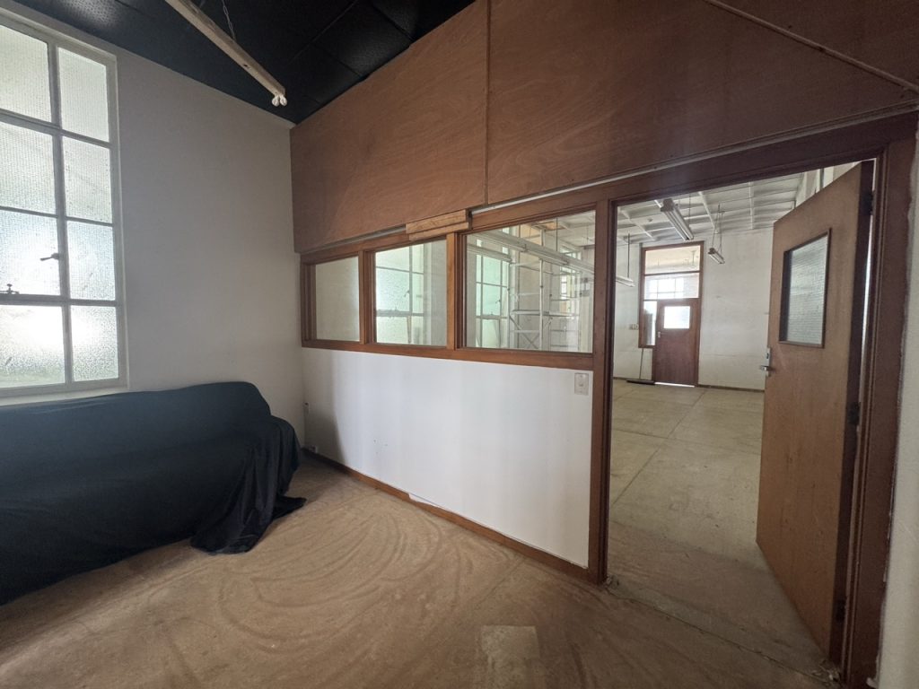 Partitioned interior space at The Exchange with timber-framed internal window